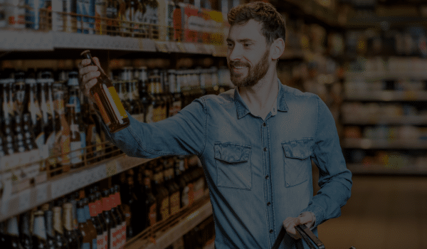 Alcohol Distributor Ireland - man selecting a beer in shop