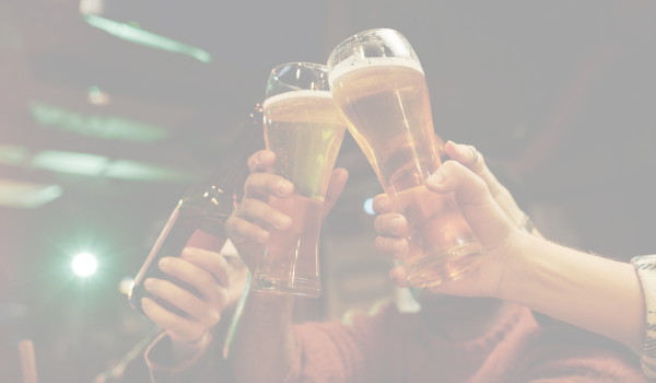 2 friends cheersing a pint of beer - beer distributor ireland