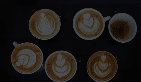 Coffee Distributor Ireland - latte art in 5 cups and one empty cup