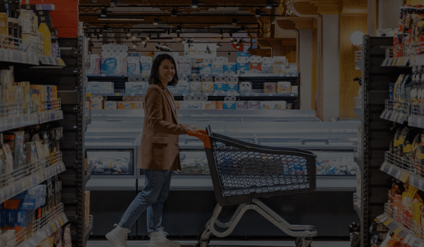 Coffee Distributor Ireland - woman in shops walking aisle